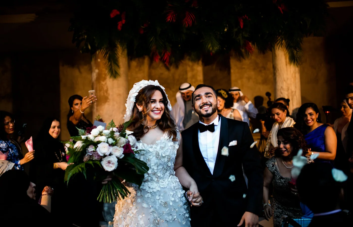 Luxury wedding guests celebrating at a grand Saudi Arabia event