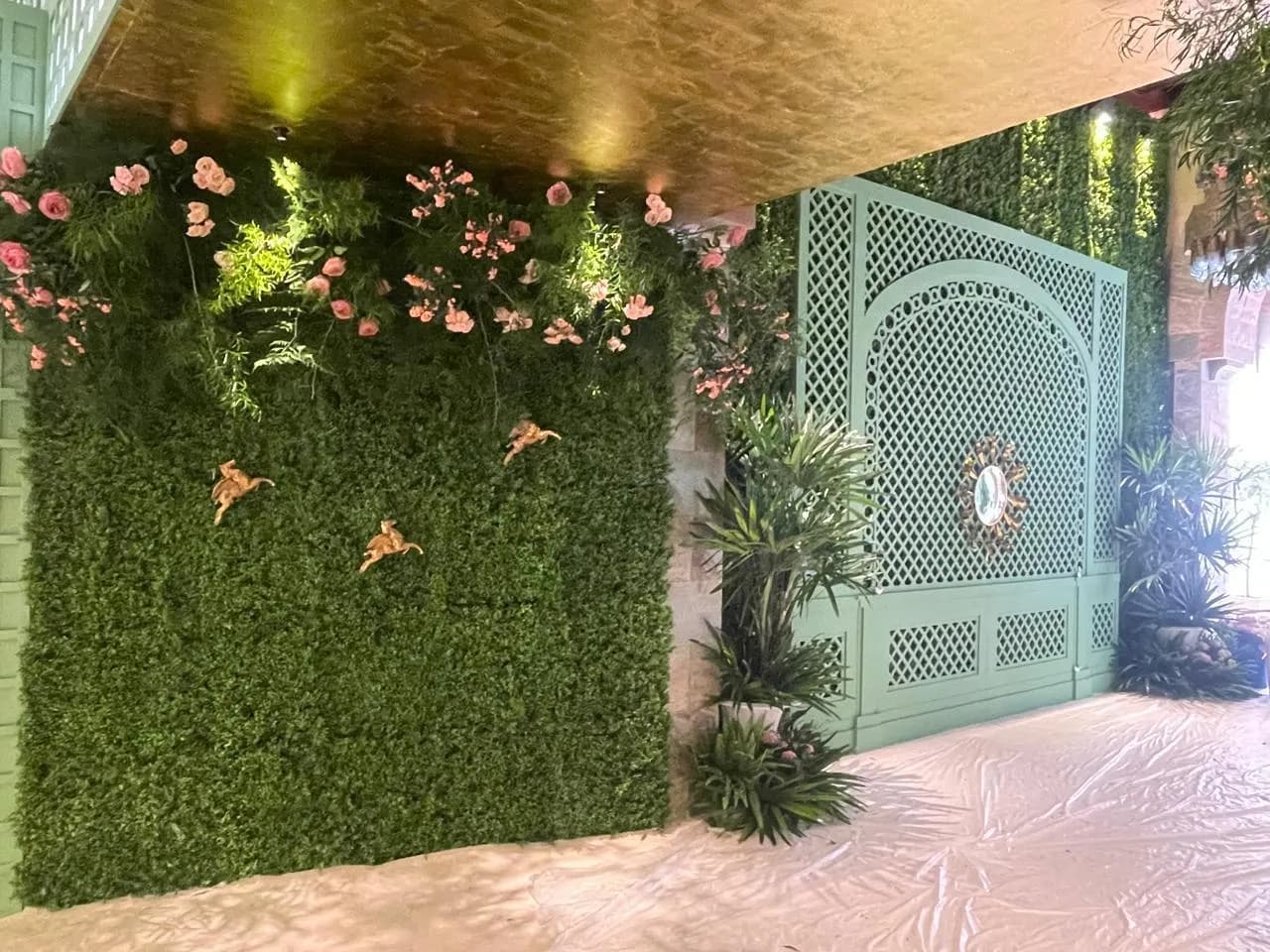 Floral wall and garden-trellis detailing from a wedding build by our partner production network